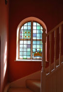 This stained-glass window was designed to commemorate the coronation of King Charles