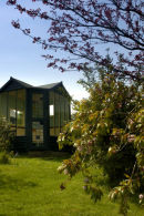 The summerhouse actually started life as a small railway station waiting room.